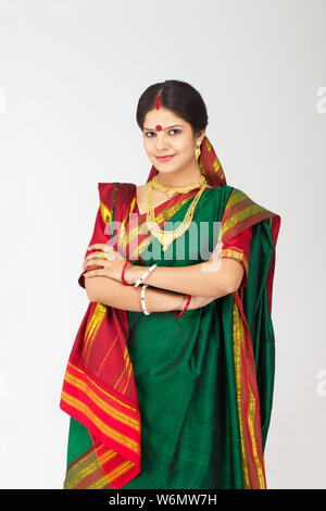 Bengali woman smiling with arms crossed Stock Photo