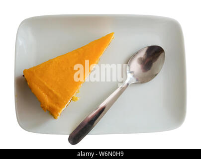 Top view of delicate chiffon cake with mango jelly served on white plate. Isolated over white background Stock Photo