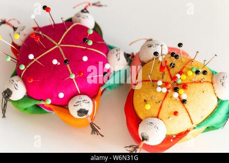 A close up view of colouful soft fabric pin holders used in sowing on a isolated background Stock Photo