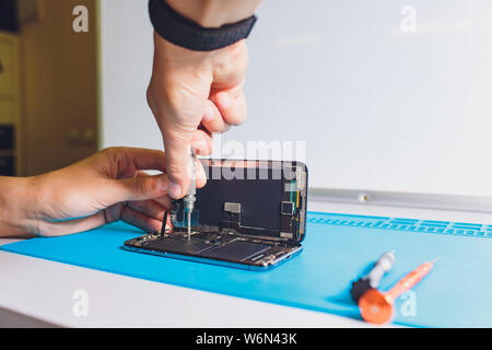 Close-up photos showing process of mobile phone repair. Stock Photo