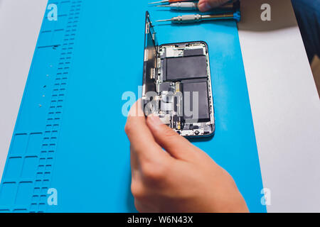 Close-up photos showing process of mobile phone repair. Stock Photo