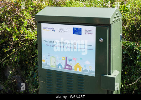 BT Openreach superfast fibre broadband green junction box in a rural Welsh community. Llanbedrgoch, Isle of Anglesey, north Wales, UK, Britain Stock Photo