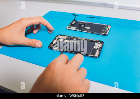 Close-up photos showing process of mobile phone repair. Stock Photo