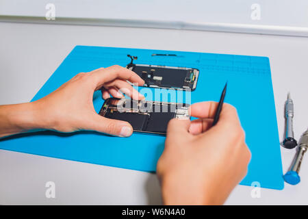 Close-up photos showing process of mobile phone repair. Stock Photo