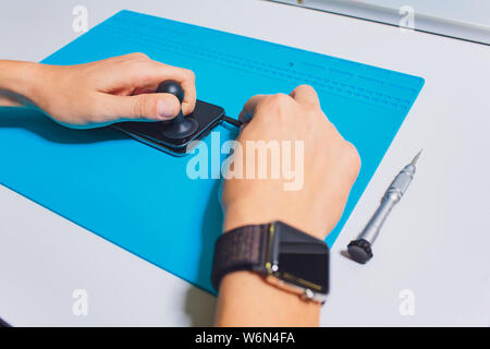 Close-up photos showing process of mobile phone repair. Stock Photo