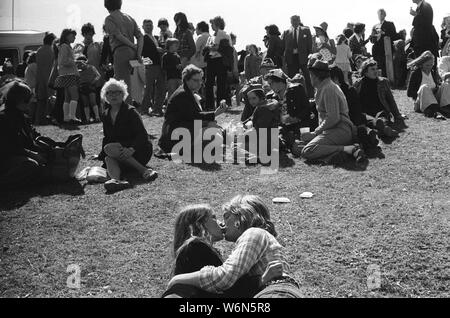 Young couple share a kiss, embrace each other at the annual Durham Miners Gala. Durham, County Durham. England 1974  1970s UK HOMER SYKES Stock Photo