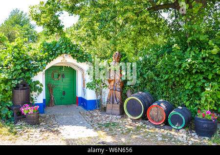 Petrov-Plze, Czech Republic - August 14 2014: Typical wine cellars in Moravia decorated with traditional slavic wine motives. Moravia wine region, tourism. Traditional buildings. Wine barrels. Stock Photo