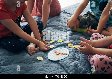 Kids learning how to tell time from clock and set the hands in the correct position. Teaching preschoolers tell time. Candid people, real moments, aut