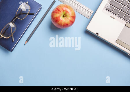 Desktop for student with a computer and an apple Stock Photo