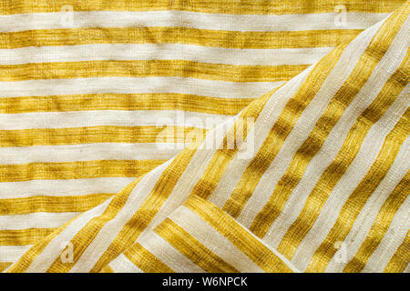 Yellow-White Striped Fabric Background. Gold Metallic Thread Striped Knitted Fabric