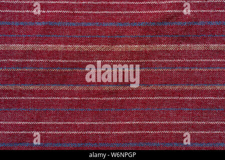 Red coarse fabric with thin stripes of a different color. Texture fabric blank background Stock Photo