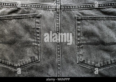 Gray jeans pockets. Texture of cotton fabric pants. Gray denim fabric Stock Photo