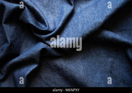 Navy blue fabric texture background top view. Crumpled Cloth Blank Background Stock Photo