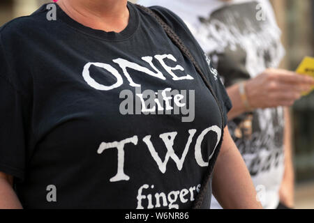 Blackpool, Lancashire, UK. 2nd Aug, 2019. 'One Life Two Fingers' Tshirt  at the Rebellion Festival world's largest punk festival in Blackpool. At the beginning of August, Blackpool's Winter Gardens plays host to a massive line up of punk bands for the 21st edition of Rebellion Festival attracting thousands of tourists to the resort. Over 4 days every August in Blackpool, the very best in Punk gather for this social event of the year with 4 days of music across 6 stages with masses of bands. Credit; Credit: MediaWorldImages/Alamy Live News Stock Photo