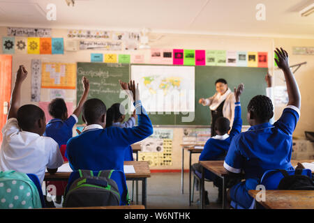 Schoolchildren and teacher in a lesson at a township school Stock Photo