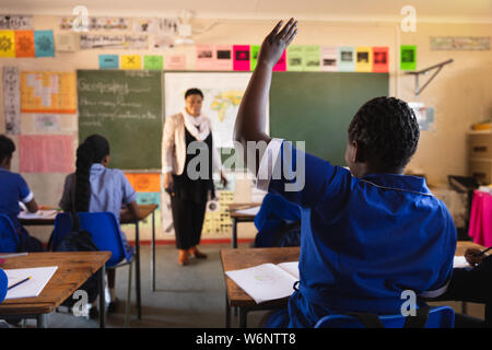 Schoolchildren and teacher in a lesson at a township school Stock Photo