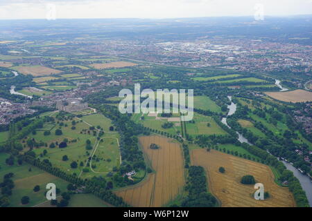 WINDSOR, ENGLAND -28 JUL 2019- Aerial view of the town of Windsor and the Windsor Castle, property of the British Monarchy in Windsor, England, United Stock Photo