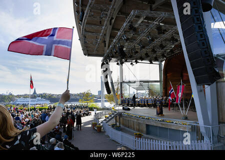 Norwegians and Scandinavian crowds attending the live concert events during Norways' national independence day celebrations in Skansen park. Sweden Stock Photo