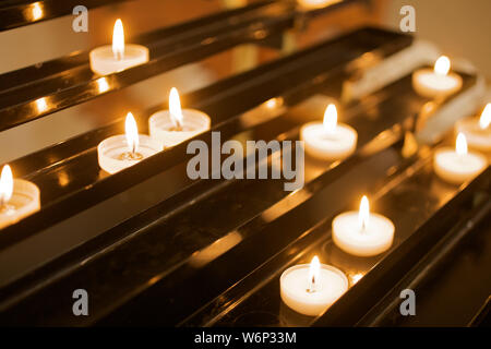Candles lighting in Catholic Church Stock Photo