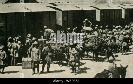 British and Indian soldiers at Bombay, India, First World War, 1914, (c1920). 'India's Army for the European War: Unloading Regimental Baggage before embarking at Alexandra Dock, Bombay', [Mumbai]. Over one million Indian troops in the British Indian Army (of the Raj) fought in the European, Mediterranean and the Middle East theatres of war. At least 74,187 Indian soldiers died, with 67,000 wounded. From &quot;The Great World War - A History&quot; Volume I, edited by Frank A Mumby. [The Gresham Publishing Company Ltd, London, c1920] Stock Photo