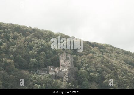 Rheinstein Castle, Germany - 27 April 2019: View of the Castle in the hill Over the Rhine river Stock Photo