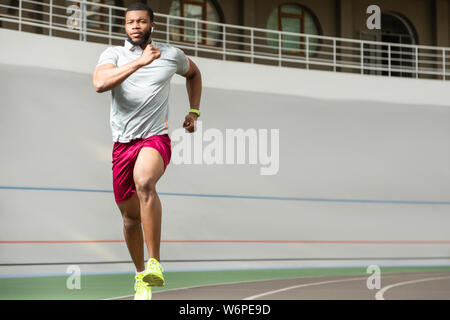 Strong young African American athletic man in sneakers Stock Photo