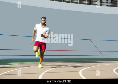 Active young male athlete on the running track Stock Photo