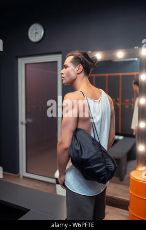 Nice handsome man looking at the lockers Stock Photo