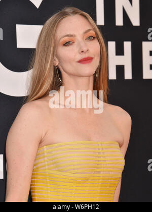 LOS ANGELES, CA - AUGUST 01: Amanda Seyfried attends the Premiere Of 20th Century Fox's 'The Art Of Racing In The Rain' at El Capitan Theatre on August 01, 2019 in Los Angeles, California. Stock Photo