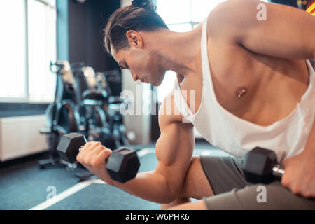 Serious young man focusing on his training Stock Photo