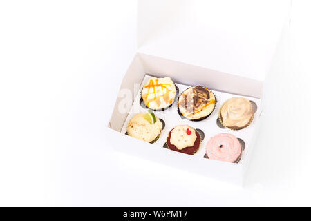 Sweet dessert, cupcake with butter cream isolated on white background. Stock Photo