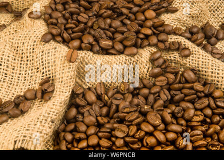 Shot of a sack of roasted coffee beans ready to be ground for a fresh coffee experience. Stock Photo