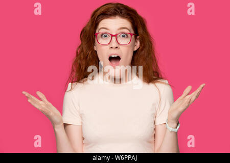 Girl in glasses open mouth makes big eyes feels amazed Stock Photo