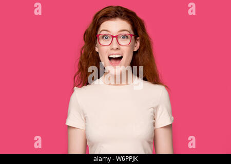 Woman in glasses open mouth feels happy looking at camera Stock Photo