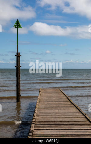 Wooden jetty leading out into the water at Llandudno North Wales May 2019 Stock Photo