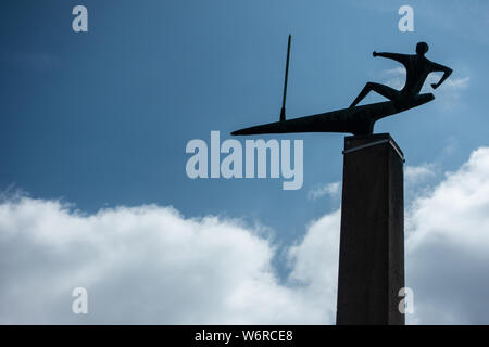 The Sailor' by Karlheinz Goedtke Bronze monument stands on the sea pier at Kiel Stock Photo