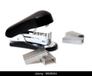 a lot of staple and stapler on white background Stock Photo