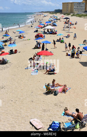 Tourist enjoying Nags Head Beach on the Outer Banks of North Carolina. Stock Photo