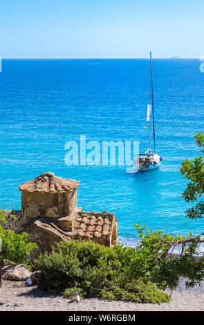 Agios Pavlos beach with Saint Paul church, a very old Byzantine church that was built at the place Selouda, an incredible beach at Opiso Egiali area, Stock Photo