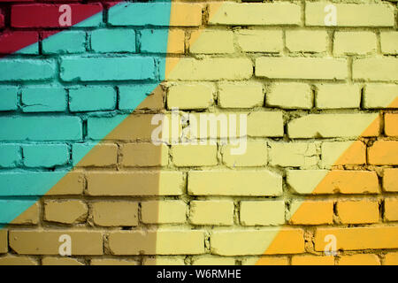 Multi-colored brick surface, painted in different colors. Creative background texture. Stock Photo