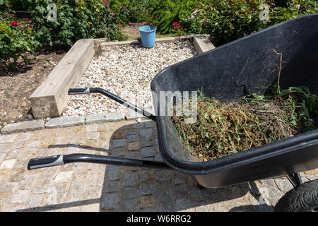 Weed removal in the garden is a never-ending work but very necessary Stock Photo