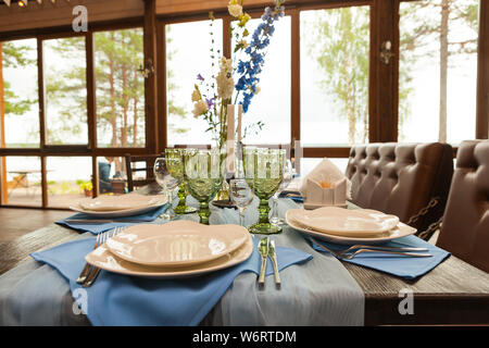 Table set for wedding with flowers, decorations and candles Stock Photo