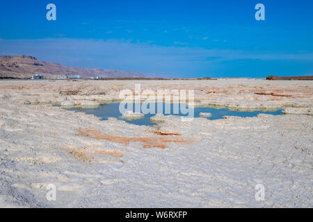 Salt formation caused by the evaporation of the water on the shore of the Dead Sea, Israel. Stock Photo