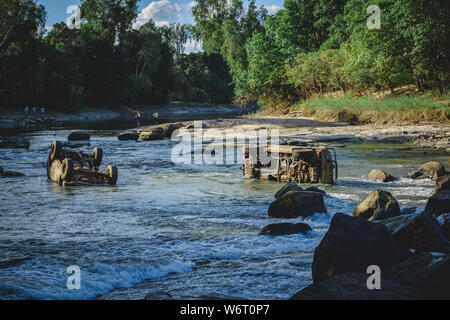 two crashed cars in river Stock Photo