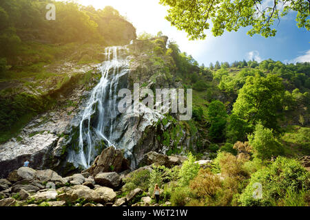 Majestic water cascade of Powerscourt Waterfall, the highest waterfall in Ireland. Famous tourist atractions in co. Wicklow, Ireland. Stock Photo