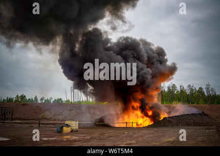 Fire on flare blow out in  oil and Gas  processing platform and remote platform produced oil, natural gas and liquid condensate Stock Photo