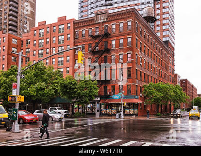 New York City, USA, March 2019, urban scene on the 10th Avenue on a rainy day in the Hell's Kitchen area Stock Photo