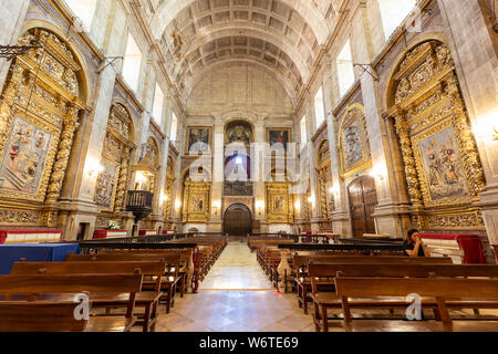 Coimb faithful praying in Monastery of Santa Clara a Nova (Saint Clare Monastery), monument and historical patrimony. Was Stock Photo