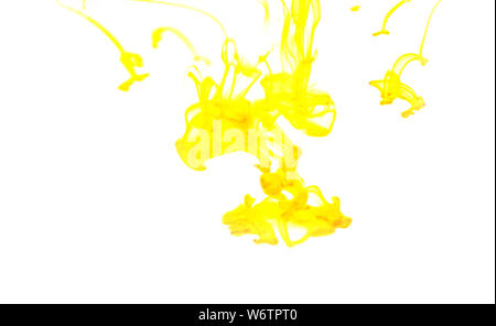 yellow ink drop Acrylic colors in water on white background , blur and selective focus Stock Photo