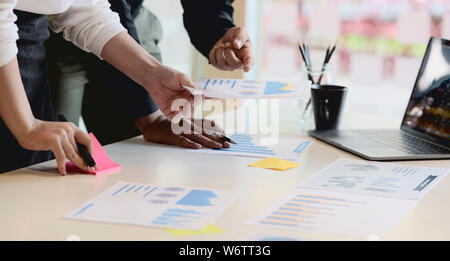 Two diverse business team discussing business project working together in office Stock Photo